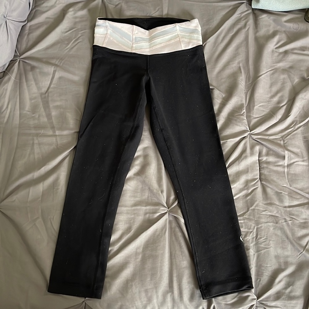 Lululemon black leggings with pink waistband, fits size 2-4